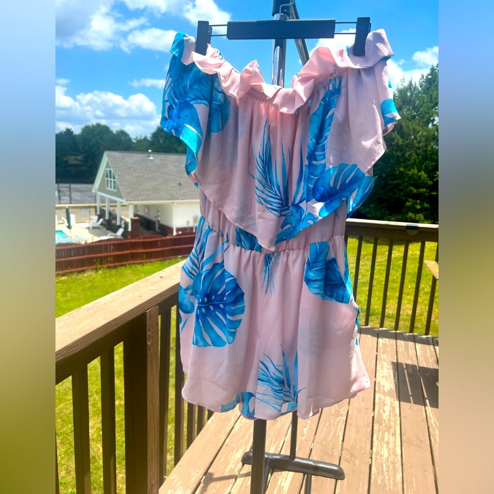 Light pink and blue Carmella brand romper with pockets and elastic waist band
